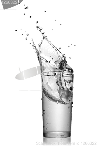 Image of water splash in glass isolated on white