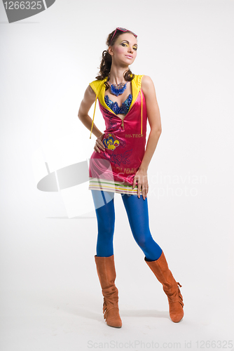 Image of Beautiful young woman posing in color wear