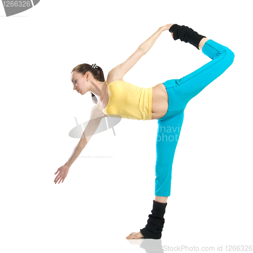 Image of beautiful girl doing gymnastics on white background