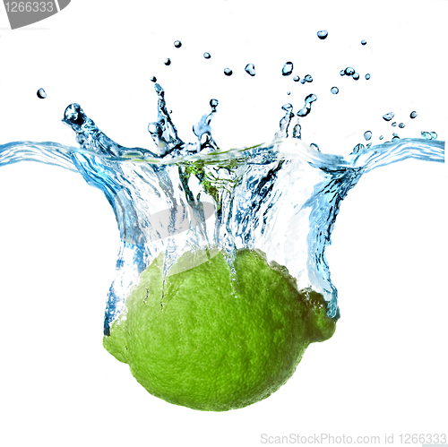 Image of Fresh lime dropped into water with splash isolated on white