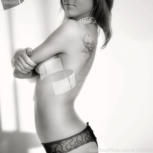 Image of black and white photo of sexy anonymous girl with the naked back
