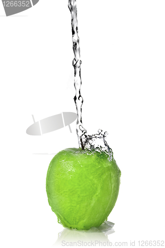 Image of fresh water splash on green apple isolated on white