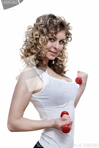 Image of Portrait of young sexy woman holding dumbbells isolated on white