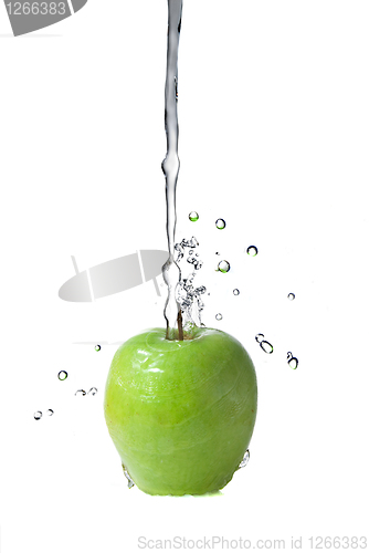 Image of fresh water splash on green apple isolated on white