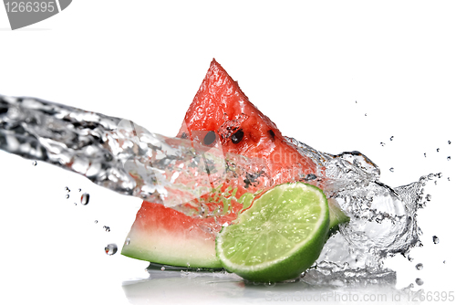 Image of watermelon with lime and water splash isolated on white