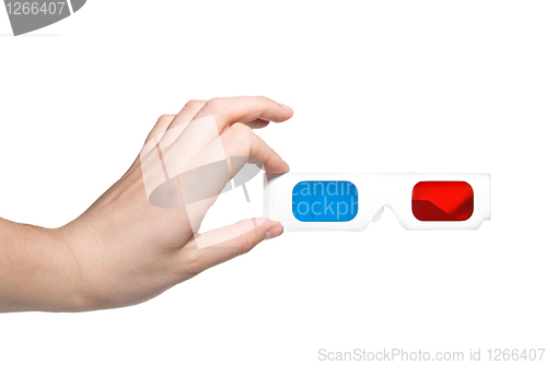 Image of hand holding stereo glasses on white background