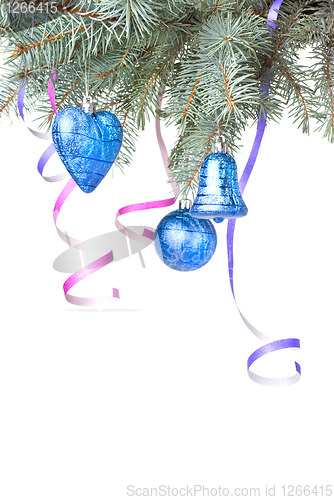Image of Christmas balls and decoration on fir tree branch isolated on wh