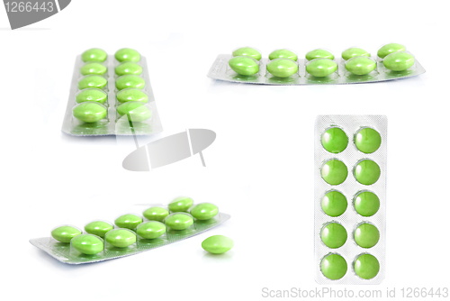 Image of packs of green tablets isolated on white