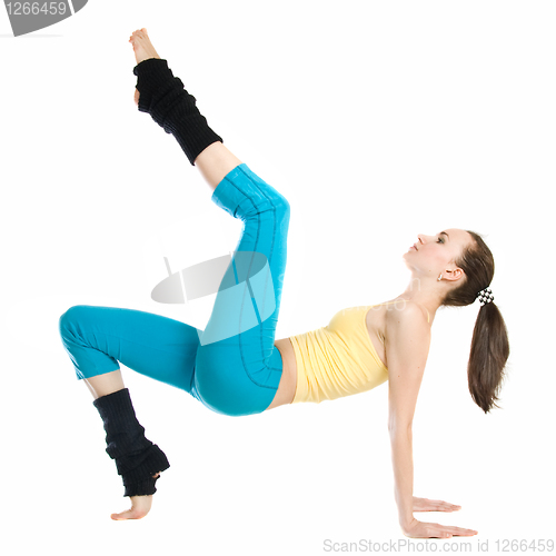 Image of beautiful girl doing gymnastics on white background