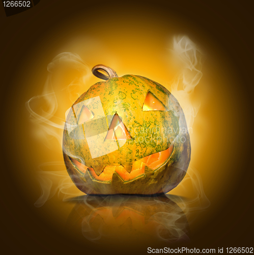 Image of halloween pumpkin on yellow with smoke