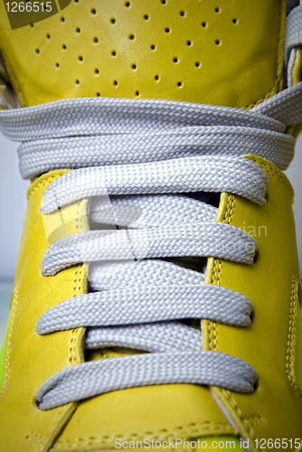 Image of close-up laces on the yellow boots