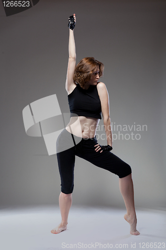 Image of attractive young woman dancing