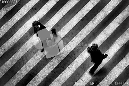 Image of Busy crosswalk scene on the stripped floor