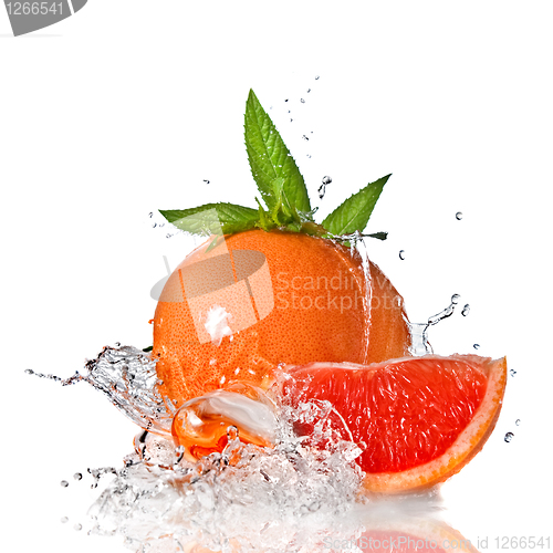 Image of Water splash on grapefruit with mint isolated on white