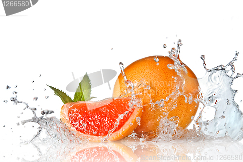 Image of Water splash on grapefruit with mint isolated on white