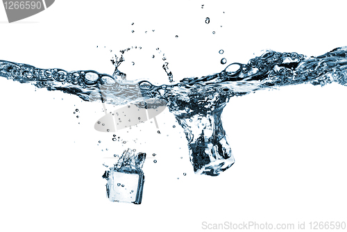 Image of ice cubes dropped into water with splash isolated on white