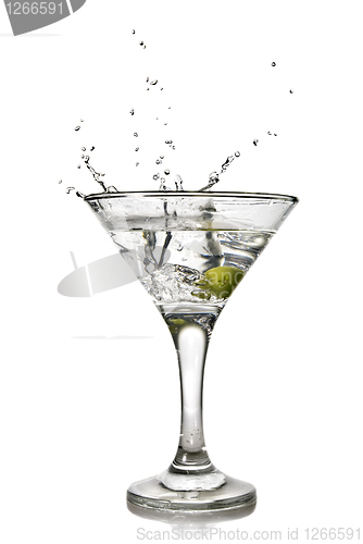 Image of martini with olive and splash isolated on white