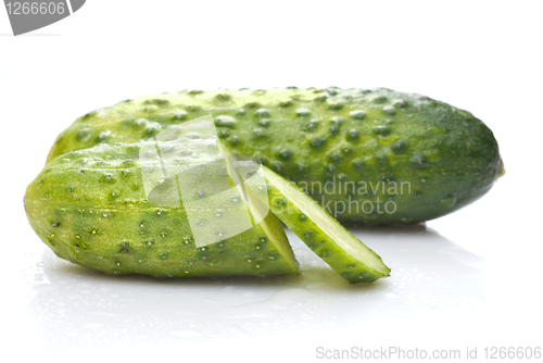 Image of green cucumber with water drops isolated on white