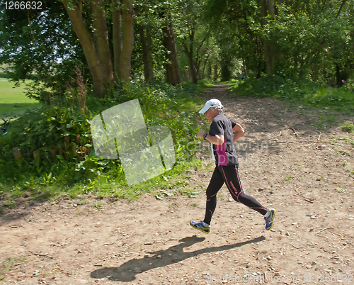 Image of Older woman running race