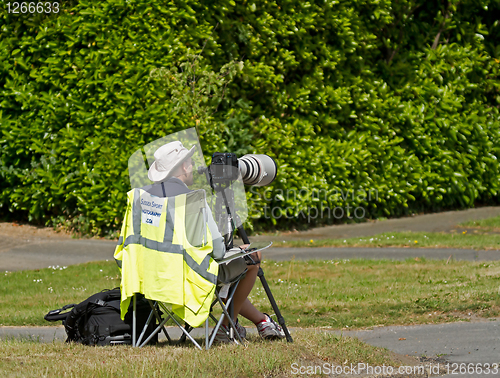 Image of Photographer by roadside during triathlon