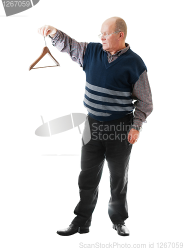 Image of Confident man in glasses holds empty cloth hanger