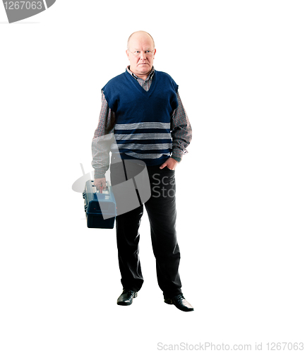 Image of Confident man standing with toolbox in right hand