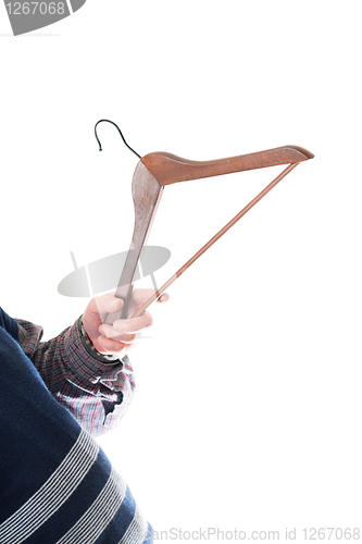 Image of Man's hand with empty cloth hanger