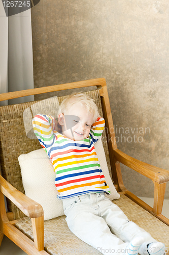 Image of toddler lying in the chair