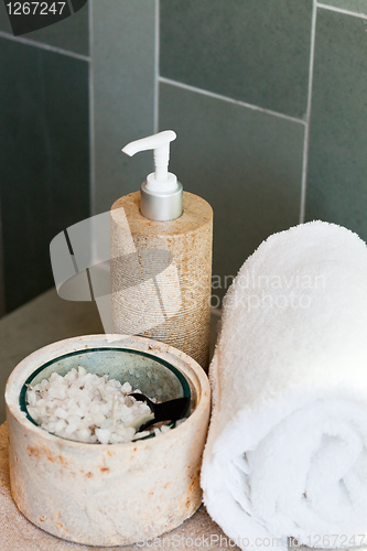 Image of dispenser, bath salt and towel