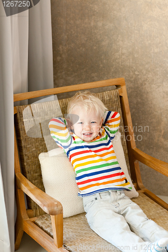 Image of toddler lying in the chair