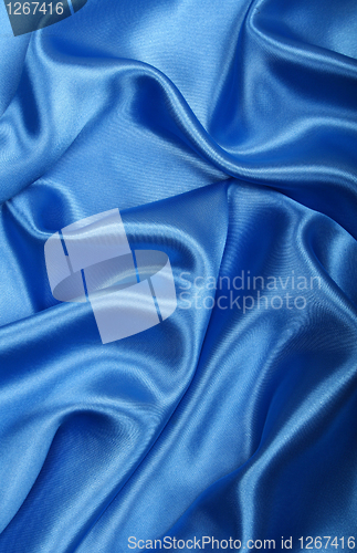 Image of Smooth elegant blue silk as background 