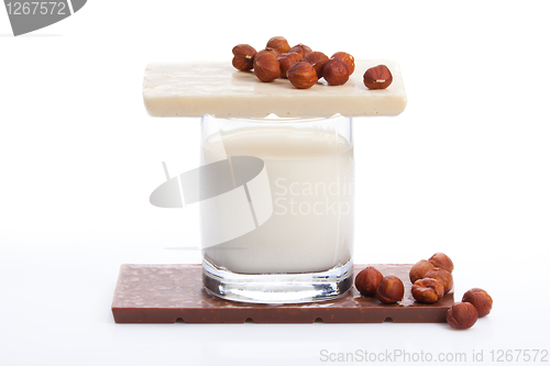 Image of Glass with milk and chocolate with nuts