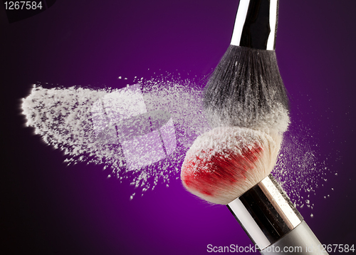 Image of Makeup powder and brushes