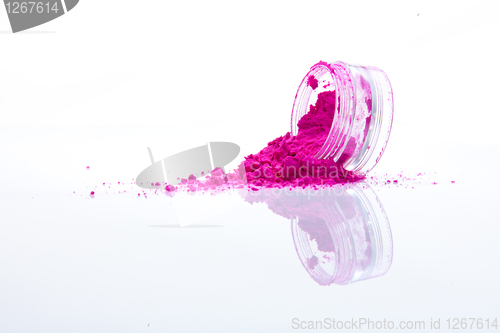 Image of spilled pink makeup powder