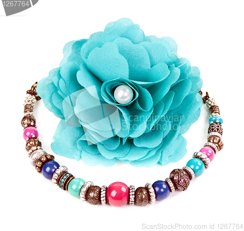 Image of turquoise fabric flower and color bracelet