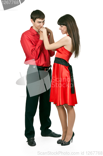 Image of man kissing woman's hand