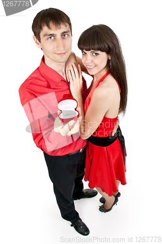 Image of man gives the woman a ring