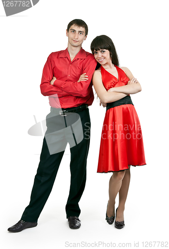 Image of man and woman in a red dress