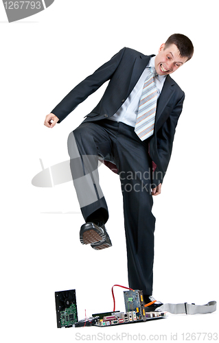 Image of Businessman trampling foot motherboard