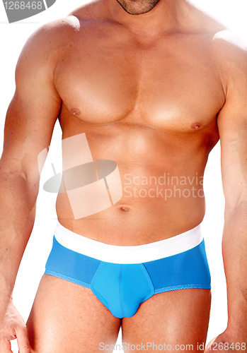 Image of Muscled man in blue swimwear