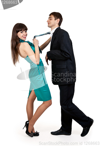 Image of girl holds a businessman in tie