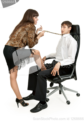 Image of she pulls a businessman tie