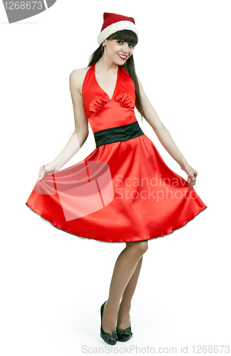 Image of girl in a red dress and hat santa
