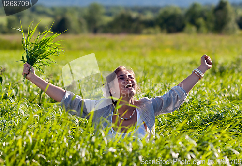 Image of girl screaming in the grass