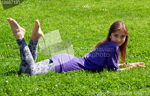 Image of girl lying on grass