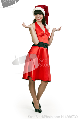 Image of girl in a red dress, hat santa