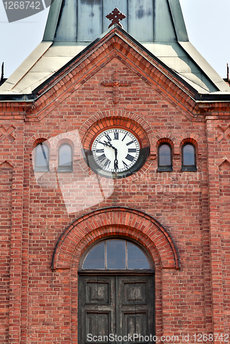 Image of clock on the old brick Church