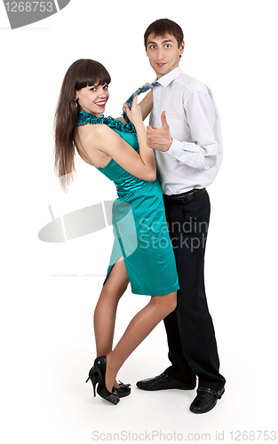 Image of girl holds a businessman in tie