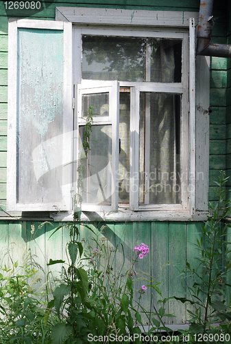 Image of Open Window of Shabby Country House