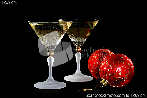 Image of Champagne glasses and Christmas balls.